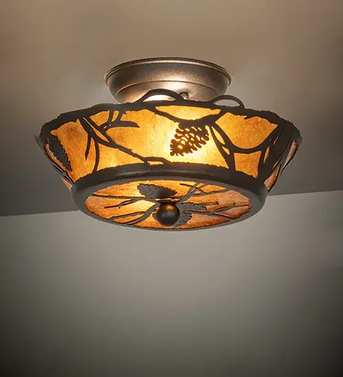 Listen closely. You can almost hear the soft whisper of the pine branches as they dance in the wind. Enjoy the warm ambiance of soft beautiful light diffused through an Amber Mica shade featuring stunning Pinecone and Pine Branch designs. The ceiling fixture is featured in a Textured Black finish. Handcrafted by highly skilled artisans in our 180,000 square manufacturing facility in Yorkville, New York. Shade colors, metal finishes and sizes can be customized. UL and cUL listed for dry and damp locations. Collection: Whispering Pines Finish: Textured Black Glass: Amber Mica Width: 10.00" Height: 6.50" Length: 10.00" Weight: 3.00 lb Number of Bulbs: 2 Maximum Wattage: 60.00 W Bulb Type: B10 Bulb Base: E12 Light Source: LED Color Temperature: 2700 K Material: Steel Country of Origin: USA Safety Listing: Damp Safety Rating: Damp LED