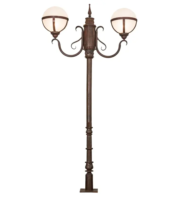 Bola Tavern creates dramatic visual interest with sophistication, romance and elegance. This indoor/outdoor Cast Iron street lamp features two Contrail Mist Idalight orb diffusers cradled with deco accents and complemented with a Rusty Nail finish. This floor lamp custom mounts directly to the ground surface. Handcrafted by highly skilled artisans in our 180,000 square foot manufacturing facility in Yorkville, New York. Lens colors and materials, metal finishes and sizes can be customized to meet your needs. UL and cUL listed for dry, damp and wet locations. Designed by Karen Hanlon. Collection: Bola Finish: Rusty Nail Glass: Contrail Mist Idalight Width: 42.50" Height: 84.00" Length: 12.00" Weight: 73.50 lb Extension from Wall: 12.50" Number of Bulbs: 2 Maximum Wattage: 60.00 W Bulb Type: A19 Bulb Base: E26 Material: Cast Iron/Steel Country of Origin: USA Safety Listing: Wet Safety Rating: Wet