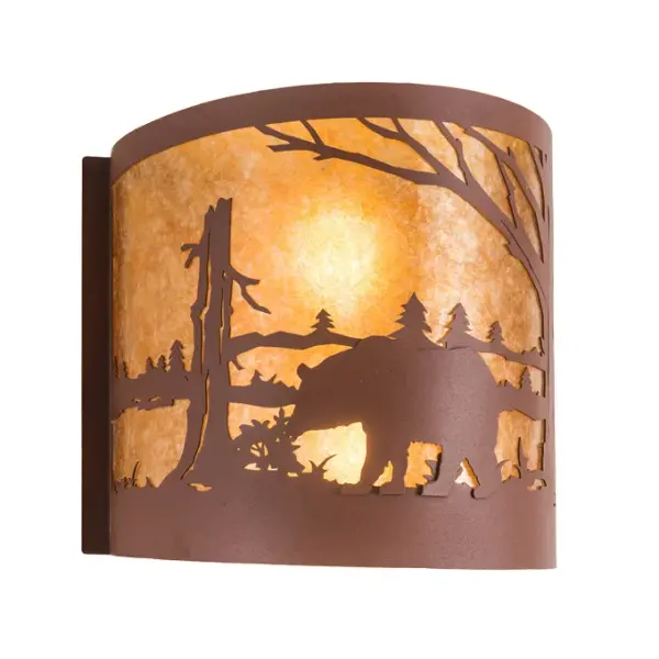 The call of the wild comes to light with a majestic Bear roaming around the woodland lake. Beautiful ambient light shines through the beautiful Amber Mica lens while the fixture is enhanced with accents and hardware featuring a Rust finish. The wall sconce can be installed in dining rooms and entryways in residential; hospitality; and commercial spaces. To complement this fixture; you can check out the Bear at Lake Right Wall Sconce; model 282456. The Bear at Lake Wall Sconces are featured in our American-made; American-designed; handcrafted Wildlife Lighting Collection. This fixture is manufactured in Yorkville; New York. It is UL and cUL listed for dry and damp locations. Upstate New York's adventurous playland; known as the Adirondack Mountains; with its many breathtaking forests; lakes; and rivers; is the spiritual birthplace of Meyda and inspires our rustic-themed mica collections.