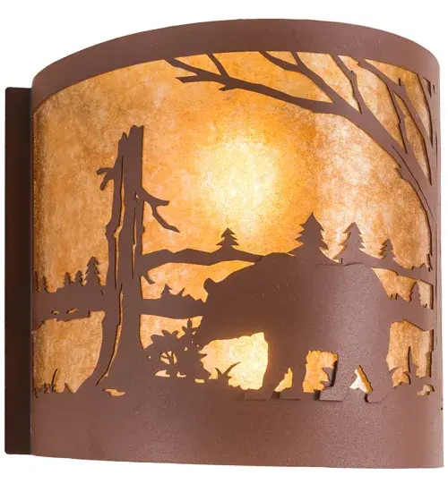 The call of the wild comes to light with a majestic Bear roaming around the woodland lake. Beautiful ambient light shines through the beautiful Amber Mica lens while the fixture is enhanced with accents and hardware featuring a Rust finish. The wall sconce can be installed in dining rooms and entryways in residential; hospitality; and commercial spaces. To complement this fixture; you can check out the Bear at Lake Right Wall Sconce; model 282456. The Bear at Lake Wall Sconces are featured in our American-made; American-designed; handcrafted Wildlife Lighting Collection. This fixture is manufactured in Yorkville; New York. It is UL and cUL listed for dry and damp locations. Upstate New York's adventurous playland; known as the Adirondack Mountains; with its many breathtaking forests; lakes; and rivers; is the spiritual birthplace of Meyda and inspires our rustic-themed mica collections. - alternate view