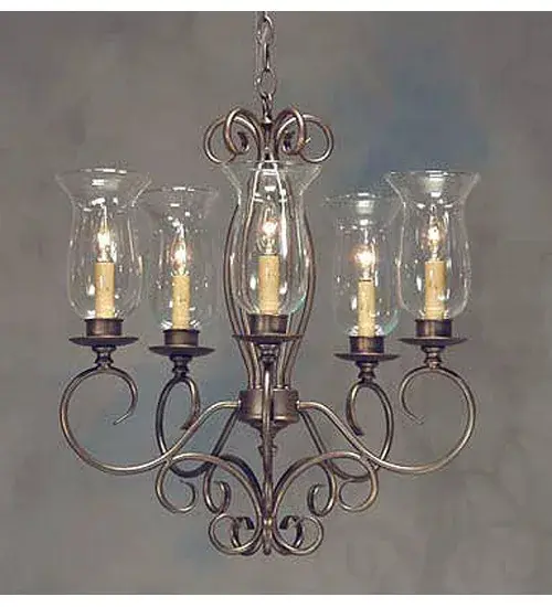Bring a graceful balance of charm and light to your home with the elegant Narcissus wall sconce. Five Clear Hurricane Glass Shades reveal Ivory faux candlelights that provide ambient illumination. The fixture is enhanced with Gilded Tobacco finished scrolled accents and hardware. The chandelier is ideal for illuminating hallways, dining areas, and living spaces in residential and hospitality settings. It is perfect for homes and restaurants from the Blue Ridge Mountains in North Carolina, Keene, New Hampshire, and Cincinnati, Ohio. The Calista 5 Light Chandelier is featured in our American-made, American-designed, handcrafted Traditional Lighting Collection. It was manufactured in Yorkville, New York. UL & cUL listed for dry and damp locations. Collection: Calista Finish: Gilded Tobacco Glass: Clear Hurricane Glass Width: 22.00" Height: 23.00" Length: 22.00" Weight: 7.00 lb Number of Bulbs: 5 Maximum Wattage: 60.00 W Bulb Type: BA9 Bulb Base: E12 Material: Steel Country of Origin: USA Safety Listing: Dry Safety Rating: Damp