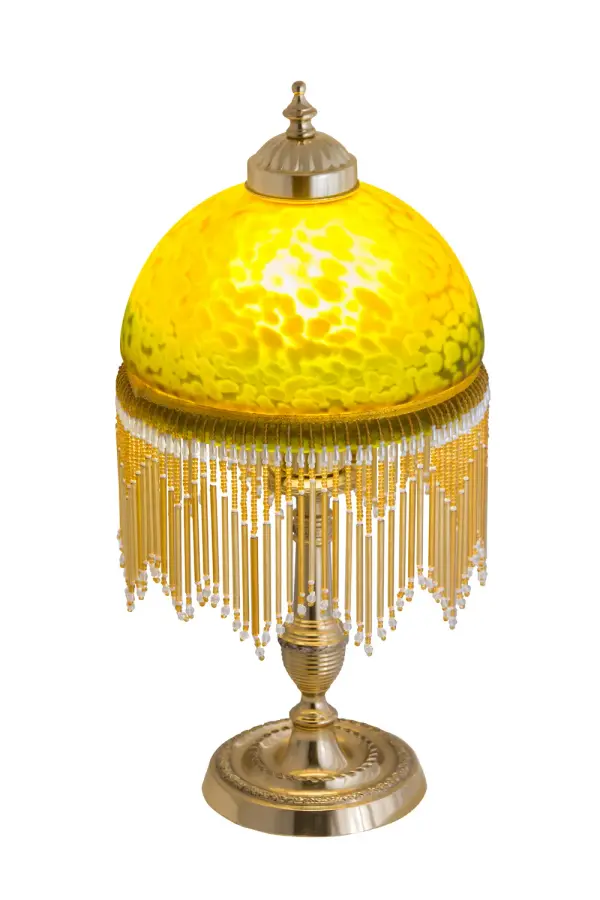 A charming nostalgic accent lamp. This Roussillon Lamp features a stunning Amber/Green Mottled Glass shade that is color coordinated with delicate Clear and Gold glass beaded fringe. This Victorian-inspired, intricately detailed shade is combined with a beautifully detailed lamp base in Brass plated finish. Collection: Roussillon Glass: Amber Glass/Acrylic Width: 8.00" Height: 17.00" Length: 8.00" Weight: 3.50 lb Number of Bulbs: 1 Maximum Wattage: 60.00 W Bulb Type: A19 Bulb Base: E26 Material: Brass Country of Origin: CHINA Safety Listing: Dry Safety Rating: Dry