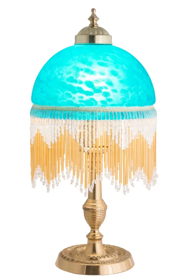 A charming nostalgic accent lamp. This Roussillon Mini Lamp features a stunning Teal Blue Mottled Glass shade that is color coordinated with delicate White and Gold glass beaded fringe. This Victorian-inspired, intricately detailed shade is combined with a beautifully detailed lamp base in a Brass plated finish. Collection: Roussillon Finish: Oil Rubbed Bronze Glass: Blue Width: 8.00" Height: 16.00" Length: 8.00" Weight: 3.50 lb Number of Bulbs: 1 Maximum Wattage: 60.00 W Bulb Type: A19 Bulb Base: E26 Material: Brass Country of Origin: CHINA Safety Listing: Dry Safety Rating: Dry