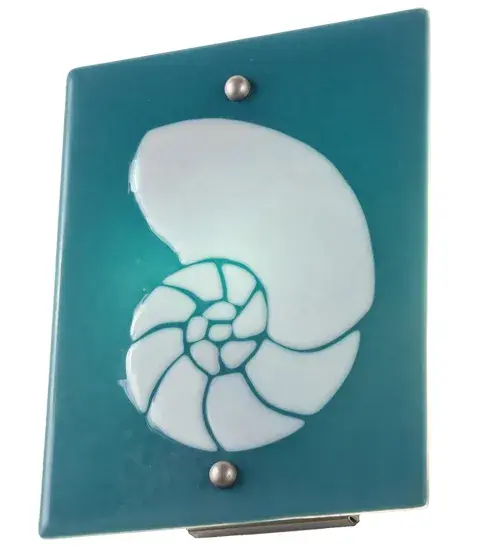 Hot high-fired glass is transformed into a cool abstract lighting design; blending a Clear Frosted Seashell design on a Dusty Blue Art Glass background. Striking fused glass defines this extraordinary sconce; which is ideal for illuminating a wide range of rooms in homes; resorts; hotels; and restaurants. Complement this fixture with the Metro Fusion Nautilus Right Wall Sconce; model 284093; to create a complete design statement. The Metro Fusion Nautilus Wall Sconces are ADA-compliant and featured in our American-made; American-designed; handcrafted Modern Lighting Collection. Both fixtures are manufactured in Yorkville; New York. UL and cUL listed for dry and damp locations. Each shade is a unique work of art; featuring color variations derived from the natural ingredients inherent in the glass. The Quality Bent Glass division of Meyda Tiffany Lighting has been in the making for over 100 years. Today; we continue to create timeless masterpieces using tools and methods that date back to the days when we supplied Tiffany Studios. Fused glass colors and metal finishes are customizable; as each fixture is handcrafted to order. - alternate view
