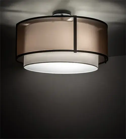 This stunning lighting fixture seamlessly blends a modern aesthetic with a minimalist design. The ceiling fixture features an alluring Brown TextraLite shade that envelops a White Textrene shade; complemented by a Statuario Idalight bottom diffuser. The fixture is enhanced with a Flat Black finish. The ceiling luminaire can illuminate a dining room or corridors in homes; lounges; and restaurants. The Cilindro Semi-Flush Mount is part of our American-made; American-designed; handcrafted Modern Lighting Collection; manufactured in Yorkville; New York. The fixture is UL and cUL listed for dry and damp locations; however; we do not recommend installing it in spaces that experience excessive moisture due to the fabric shade.