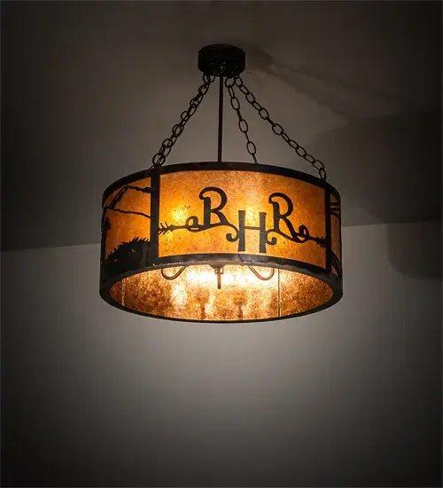 Customized for the Ridin-Hy Ranch Resort in Warrensburg; NY. This stunning rustic ceiling fixture features the resort logo and dramatic images of Horses; Horseshoe and a Cowboy in a Dark Burnished Antique Copper to match the hardware. The designs glow brilliant on the Amber Mica shade. The Ridin-Hy Personalized Semi-Flushmount is featured in our American made; American designed handcrafted Personalized Western Lighting Collection. Manufactured in Yorkville; New York. UL and cUL listed for dry and damp locations.