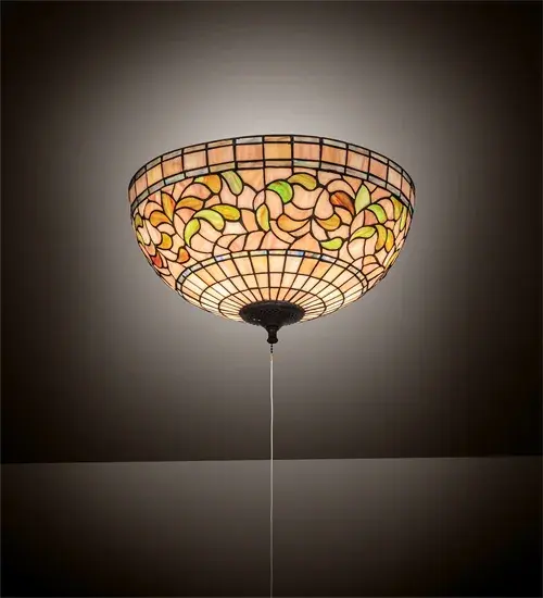 Subtle toned Autumn Gold; Russet and Moss Green leaves swirl against an Amber Mauve background in this Tiffany Studio stained glass reproduction. The shade is enhanced with bands of Purple; Blue and Green and created using the famous Meyda Tiffany copperfoil construction process. This elegant art glass ceiling fixture features hardware finished in Mahogany Bronze. Every Meyda Tiffany item is a unique handcrafted work of art. Natural variations in the glass colors make every item a masterpiece of its own. UL and cUL listed for dry and damp locations.