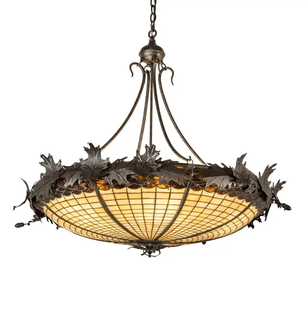 Majestic as the mighty oak; this dramatically styled pendant features an Acorn art glass profile. The stained glass shade delights with Autumnal Beige Art glass; featuring a Bark Brown Glass crown; sprouting Golden Bronze finished Oak leaf metal accents and hardware. The shade is created using the famous Meyda Tiffany copper foil construction process. The pendant is ideal for installation above a kitchen island or dining table; creating a beautiful design statement. The overall height ranges from 41 to 71 inches; as the chain can be easily adjusted on location. The Greenbriar Oak Inverted Pendant is part of our American-made; American-designed; handcrafted Greenbriar Collection. The fixture is UL and cUL listed for dry & damp locations. Each shade is a unique work of art; featuring color variations derived from the natural ingredients inherent in the glass. Please don't hesitate to contact us if color matching is critical when ordering multiple items.