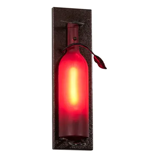 This Meyda Wine Bottle Wall Sconce does so much more than deliver light, it adds personality and pizzazz. A stunning Red half-wine bottle features Textured Black vine-like accents and a Copper Vein finished wallplate. Perfect for entryways and other spaces in homes, restaurants, hotels, pubs, nightclubs, wineries, and retailers, this wall luminaire will be appreciated for its fine detail and charm by connoisseurs from Washingtonville, New York, to Bluemont, Virginia, to Napa Valley, California. This rich-looking Tuscan Vineyard Wine Bottle Wall Sconce is included in our American-made, American-designed, handcrafted Wine Bottle Lighting Collection. The fixture is manufactured in Yorkville, New York. UL and cUL listed for dry and damp locations. Take your finest bottle of wine, and Meyda will transform it into an everlasting personalized fixture of light. Contact us for more information on custom wine bottle lighting fixtures and lamps. You can also create custom lighting with beer bottles, mason jars, milk bottles, and other glass containers and vessels by contacting us! Collection: Tuscan Vineyard Finish: Copper Vein/Black Leaf Glass: Red Sandblasted Width: 3.50" Height: 15.00" Length: 3.50" Weight: 1.50 lb Extension from Wall: 3.50" Number of Bulbs: 1 Maximum Wattage: 40.00 W Bulb Type: T6.5 Bulb Base: E17 Material: Steel Country of Origin: USA Safety Listing: Damp Safety Rating: Damp - alternate view