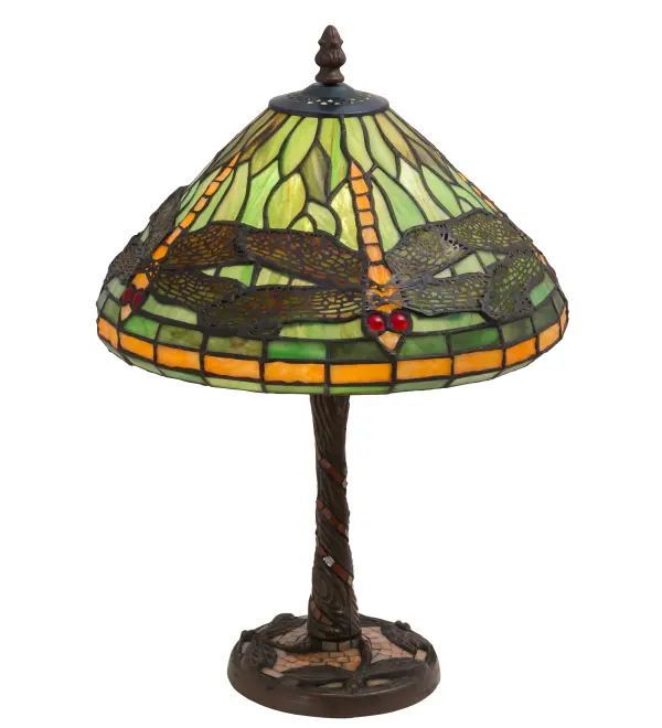 Elegant and stunning. This version of Tiffany Studio's most beloved stained glass dragonfly design is modeled after the original hanging-head dragonfly. Diving dragonflies with glowing Scarlet jeweled eyes and delicate metal filigree wings circle over hand-cut and copper foiled pieces of Amber accented Pond Green art glass; representing an early evening sky reflecting on rippling water. The table lamp base is finished in a warm hand-applied Mahogany Bronze. The lamp illuminates tables and desks in homes; offices; and restaurants from Boston; Massachusetts; to Des Moines; Iowa; to Billings; Montana. The Dragonfly W/Twisted Fly Mosaic Base Table Lamp is included in our American-designed; handcrafted Stained Glass Collection. Each shade is a unique work of art with color variations based on natural ingredients inherent in the glass. UL and cUL listed for dry locations.