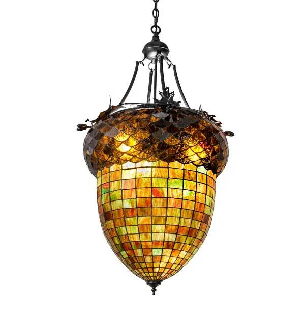 This stunning ceiling pendant is as majestic as the mighty oak. The stained glass shade delights with Multi-Toned Autumn Green Art glass and a Bark Brown Granite Textured Glass crown sprouting Textured Black Oak leaf-covered hardware that is handmade by Meyda artisans. The shade is created using the famous Meyda Tiffany copperfoil construction process and includes a Crystal Idalight top diffuser. The overall height ranges from 46 to 58 inches as the chain easily adjusts in the field. The Greenbriar Oak Pendant is included in our American-designed, handcrafted Greenbriar Collection. UL and cUL listed for dry and damp locations. No two art glass shades will be the same, their individuality can be as remarkably unique as their personality. Collection: Greenbriar Oak Finish: Textured Black Glass: Stained Glass And Crystal Idalight Width: 22.00" Height: 46.00" Length: 22.00" Weight: 28.00 lb Number of Bulbs: 3 Maximum Wattage: 12.00 W Bulb Type: A19 Bulb Base: GU24 Light Source: LED Material: Steel Country of Origin: USA Safety Listing: Damp Safety Rating: Damp LED