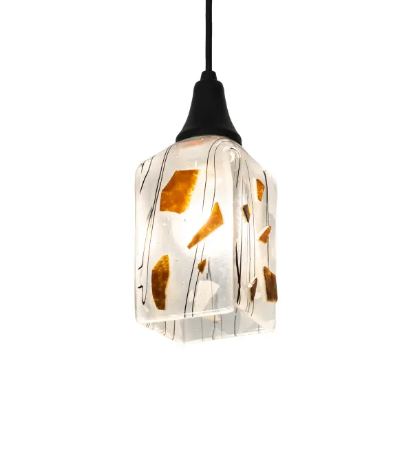A sweet design with a mouth-watering fused glass lighting effect; the Licorice mini pendant has a cool look created from hot; high-fired glass and is designed to fall into a draped art glass shape. Licorice Black streaks and accents are highlighted against a Clear glass. The art glass shade is complemented with Brass hardware featured in Textured Black with a matching suspension cord. This pendant can be placed in a group across bars; counters; and islands in fine homes and hotels; from Shelter Island; New York; to Columbus; Ohio; and to Palm Springs; California. The Metro Fusion Licorice Mini Pendant is included in our American-made; American-designed; handcrafted Fused Glass Collection; which is manufactured in Yorkville; New York. UL and cUL listed for dry and damp locations. Each shade is a unique work of art with color variations based on natural ingredients inherent in the glass. The Quality Bent Glass division of Meyda Lighting is over 100 years in the making. Today; we are still creating timeless masterpieces using tools and methods from the days when we supplied Tiffany Studios. Fused glass colors and metal finishes are customizable; as each fixture is handcrafted to order.