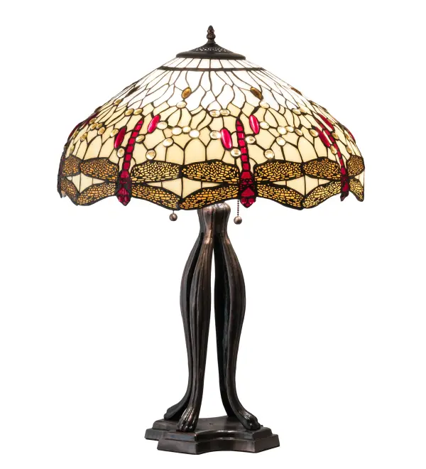 This beloved lighting design is modeled after the original Hanginghead Dragonfly from Tiffany Studios. Diving Red Dragonflies with glowing jeweled eyes and delicate metal filigree wings circle over hand-cut pieces of Beige art glass that represent sunny skies. This lovely shade is created using the famous Meyda Tiffany copperfoil construction and enhanced with an elegant Mahogany Bronze finished cast metal base. Install the lamps to illuminate picture windows, desks, and tables in Buffalo, New York, Houston, Texas, and Fremont, California. The Tiffany Hanginghead Dragonfly Table Lamp is included in our Tiffany Reproduction Collection. UL and cUL listed for dry locations. Collection: Tiffany Hanginghead Dragonfly Finish: Mahogany Bronze Glass: Ba Fl Width: 22.00" Height: 30.00" Length: 22.00" Weight: 19.00 lb Number of Bulbs: 3 Maximum Wattage: 60.00 W Bulb Type: A19 Bulb Base: E26 Material: Zinc/Steel Country of Origin: CHINA Safety Listing: Damp Safety Rating: Dry