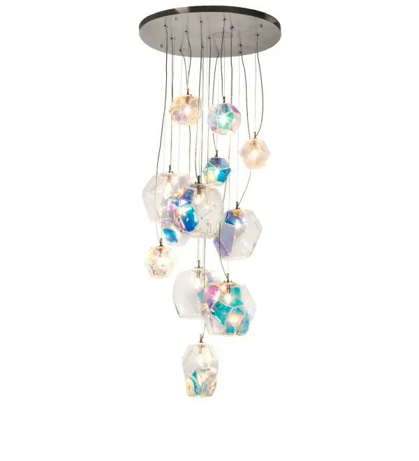 Drama and beauty appear to fall exquisitely from the sky in this stunning cascading pendant. An array of Organic styled Clear Glass Elements with Iridescent Accents dazzle and mesmerize while delivering a dozen points of light. The hardware enhances the fixture with a Nickel finish and the height of each decorative element ranges from 72 to 174 inches as the black cords and aircraft cables can be adjusted in our factory to meet your lighting needs. The Kalos Eidos Chandelier is featured in our American made; American designed Contemporary Lighting Collection. Manufactured in Yorkville; NY. UL and cUL listed for dry and damp locations.