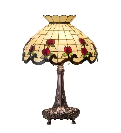 Grace your home with the elegant Roseborder Table Lamp. This lamp features an exquisitely crowned shade featuring a gridwork of Beige art Glass adorned with a Bark Brown Glass border of swirling ribbons and perfect Red Rosebuds with Green Leaf accents. The shade is made of hand-cut art glass using the famous Meyda Tiffany copperfoil construction process and embraced by a lamp base finished in Mahogany Bronze. The Roseborder Table Lamp is featured in our American-designed, handcrafted Stained Glass Lighting Collection. UL and cUL listed for dry locations. Each shade is a unique work of art with color variations based on natural ingredients inherent in the glass. Contact us if color matching is critical when ordering multiple items. Collection: Roseborder Finish: Mahogany Bronze Glass: Ba Br Xag Width: 23.00" Height: 33.00" Length: 23.00" Weight: 17.50 lb Number of Bulbs: 3 Maximum Wattage: 60.00 W Bulb Type: A19 Bulb Base: E26 Material: Steel/Zinc Country of Origin: CHINA Safety Rating: Dry - alternate view