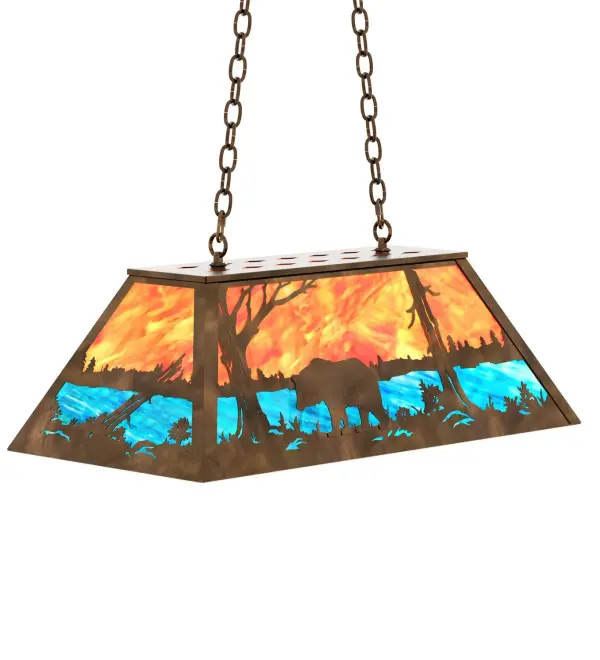 A Black Bear wanders by a lake in the woods on this nature inspired oblong pendant. Beautiful ambient illumination shines brilliantly across a Sunburst colored art glass sky above gleaming Blue-Green glass waters. Antique Copper finished hardware and accents complement this oblong pendant. Perfect for lighting a kitchen island, bar, billiard table or other space. Overall height ranges from 18 to 43 inches as the chain length can be easily adjusted in the field to accommodate your specific lighting needs. Made to Order in our 180,000 sq ft facility at the foothills of the breathtaking Adirondack Mountains. Shade colors, metal finishes and pendant sizes can be customized to meet your needs. UL and cUL listed for damp and dry Locations. Collection: Bear At Lake Finish: Antique Copper Glass: Orange & Blue-Green Art Glass Width: 17.00" Height: 19.00" Length: 33.00" Weight: 30.00 lb Number of Bulbs: 6 Maximum Wattage: 60.00 W Bulb Type: A19 Bulb Base: E26 Material: Steel Country of Origin: USA Safety Rating: Damp
