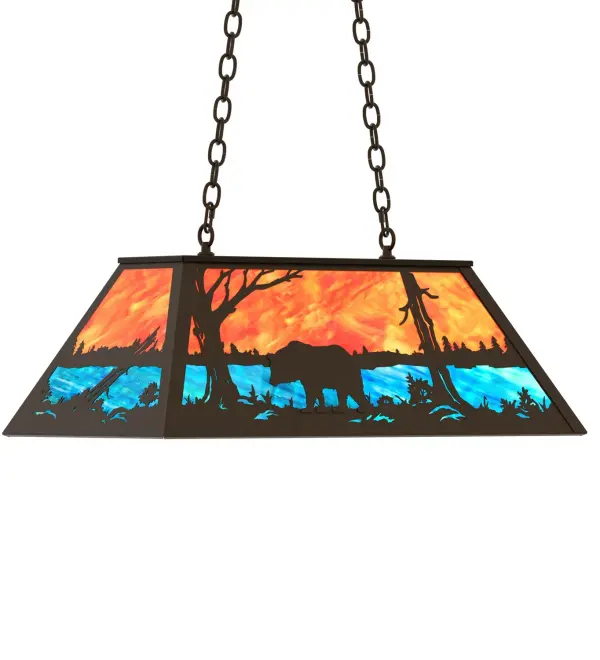 A Black Bear wanders by a lake in the woods on this nature inspired oblong pendant. Beautiful ambient illumination shines brilliantly across a Sunburst colored art glass sky above gleaming Blue-Green glass waters. Oil Rubbed Bronze finished hardware and accents complement this oblong pendant. Perfect for lighting a kitchen island, bar, billiard table, or other space Overall height ranges from 18 to 43 inches as the chain length can be easily adjusted in the field to accommodate your specific lighting needs. Made to Order in our 180,000 sq ft facility at the foothills of the breathtaking Adirondack Mountains. Shade colors, metal finishes and pendant sizes can be customized to meet your needs. UL and cUL listed for damp and dry locations. Collection: Bear At Lake Finish: Oil Rubbed Bronze Glass: Orange And Blue Art Glass Width: 17.00" Height: 19.00" Length: 33.00" Weight: 30.00 lb Number of Bulbs: 6 Maximum Wattage: 60.00 W Bulb Type: A19 Bulb Base: E26 Material: Steel Country of Origin: USA Safety Rating: Damp