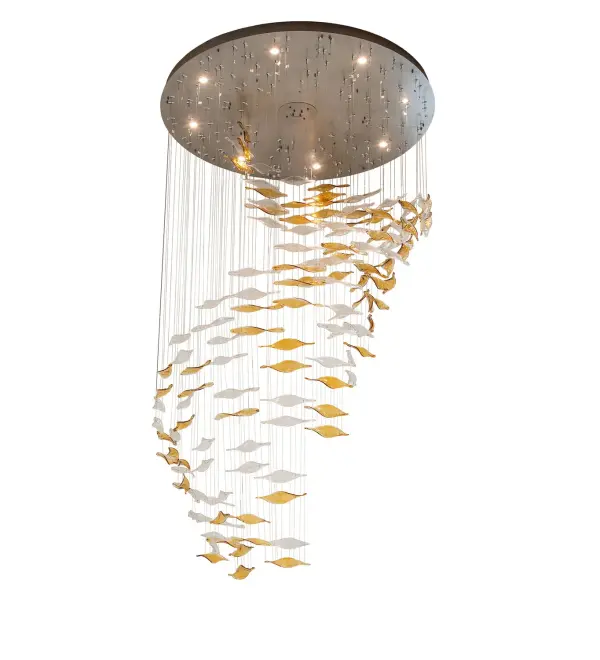 A shimmering elegance and stunning textural design define this cascading chandelier. Dozens of Amber and Clear Seeded Ribbon Elements, handcrafted from Hot-Drawn Glass, drape in a mesmerizing shower of light at varying heights. These organic, leaf-shaped accents dazzle while delivering eight points of light from the canopy above. The hardware contrasts strikingly with a Nickel finish, making it ideal for entryways and foyers in fine homes, restaurants, and hotels from Manhattan to Las Vegas. The Schole Cascading Pendant, featured in our American- made Contemporary Lighting Collection, is manufactured in Yorkville, NY. UL and cUL listed for dry and damp locations. Custom made. Call for pricing and lead time. Collection: Schole Finish: Nickel Glass: Amber & Clear Seeded Glass Width: 76.00" Height: 136.00" Length: 76.00" Weight: 230.00 lb Number of Bulbs: 8 Maximum Wattage: 50.00 W Bulb Type: MR16 Bulb Base: GU1D Material: Steel Country of Origin: USA Safety Rating: Damp