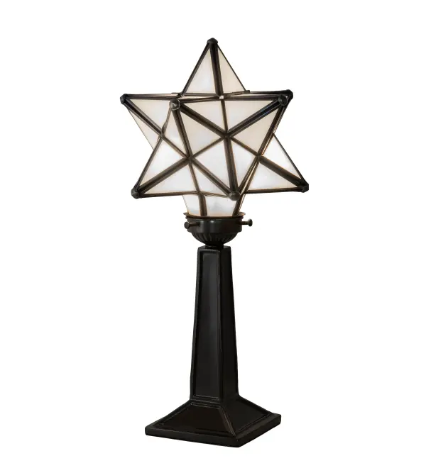 Like wishing upon a magical star in the sky, grace the interior of your home with this timeless accent lamp. Dating back hundreds of years in Europe, the Star was used to protect homes and bring good luck to families. This unique lamp features a Star-style White Glass shade, which is created with a dozen points of light. A Timeless Bronze finish complements the stunning shade, which is made using the famous Meyda Tiffany Brass Channel Construction technique. The lamp is ideal for illuminating picture windows and desks in fine residences, restaurants, and hotels. The Moravian Star Accent Lamp is part of our American-designed, handcrafted Moravian Star Collection. The fixture is UL and cUL listed for use in dry locations. Collection: Moravian Star Finish: Timeless Bronze Glass: White Width: 7.50" Height: 16.50" Length: 7.50" Weight: 3.50 lb Number of Bulbs: 1 Maximum Wattage: 60.00 W Bulb Type: B10 Bulb Base: E12 Material: Steel Country of Origin: CHINA Safety Rating: Dry