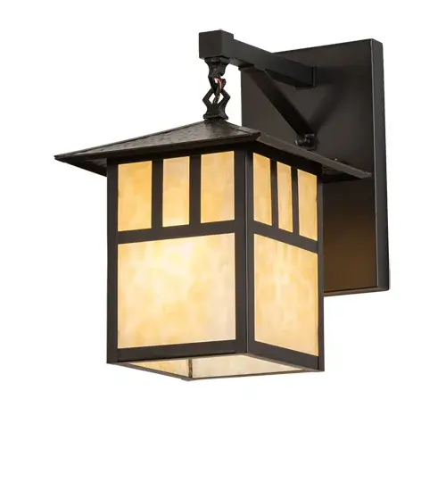 Perfect for fine interior and exterior lighting applications, the Brass T" Mission Lighting fixture features a Craftsman-style lantern. The fixture is designed with a Beige Art Glass diffuser that is complemented with a frame, decorative accents, and hardware in Craftsman Brown. The handsome indoor/outdoor lighting fixture can provide beautiful ambient lighting in hallways and facades in fine homes and other spaces, from Biltmore, North Carolina, to Dumbarton Oaks in Washington, DC, to Montecito, California. The Seneca "T" Mission Straight Arm Wall Sconce is included in our American-made, American-designed, handcrafted Craftsman Signature Series and manufactured in Yorkville, New York. UL and cUL listed for dry, damp, and wet locations. Our Build Your Own Craftsman Signature Series features unlimited combinations of styles, functions, sizes, and finishes. Options include lanterns, pier and post mounts, and deck lights crafted of marine-grade materials like brass and copper with timeless living finishes offered to endure harsh climates." Collection: Seneca Finish: Craftsman Brown Glass: Beige Art Glass Width: 9.00" Height: 13.50" Length: 12.75" Weight: 6.00 lb Extension from Wall: 12.75" Number of Bulbs: 1 Maximum Wattage: 60.00 W Bulb Type: A19 Bulb Base: E26 Material: Brass Country of Origin: USA Safety Rating: Damp - alternate view