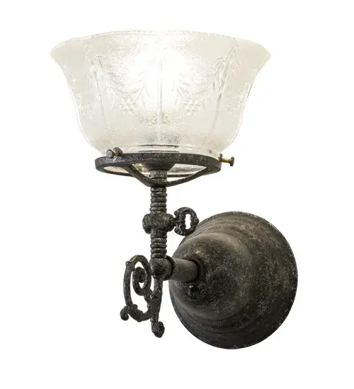 Step back in time with a traditional glass; fit; and finish. Reminiscent of lighting fixtures from the early 1900s; the Revival Brass wall fixture is designed with a shade featuring Clear Textured Revival Wheat Glass; offering an authentic historic look to complement any room or space. The Antique Pewter finished hardware is designed and crafted with the exact details of old-world artisanship. Perfect for illuminating hallways; dining areas; and living spaces in various residential and hospitality settings; including Old Bethpage on Long Island in New York and Wilmot; Ohio. The Revival Gas & Electric Wall Sconce is offered in our American-designed; handcrafted Revival Collection. UL and cUL listed for dry and damp locations. - alternate view