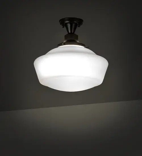 Restore the past with this always fashionable early electric reproduction Revival ceiling fixture. The fixture features a White Opal Schoolhouse Glass shade and hardware in a Black Patina finish. This vintage lighting features a refined yet consistent distinctive style that originated in traditional schoolhouses and public buildings in the early 1920s. Inspired by schoolhouses from Wells; Maine; and Columbia County; New York; to Waverly and Canaan; Pennsylvania; and Mason County; West Virginia; to Cedar Falls; Iowa; and Lawson; Missouri. The Revival Schoolhouse Semi-Flushmount is included in our American-designed; handcrafted Schoolhouse Lighting Collection. UL & cUL listed for dry and damp locations.