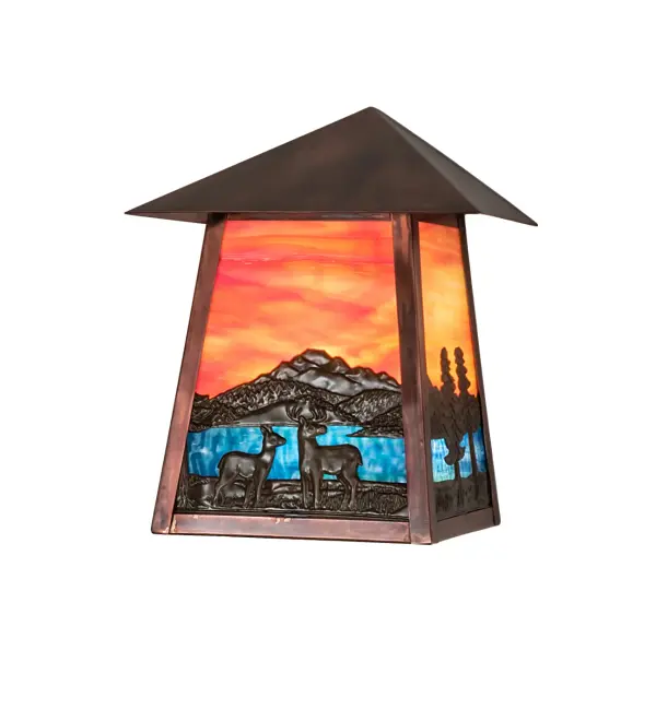 Delicately etched of Solid Brass; delicate silhouettes of Deer meandering in front of a Blue/Green mountain lake with an Orange Sky art glass accent this charming lantern-style wall sconce. Perfect for indoor and outdoor lighting applications; the stunning wall fixture is finished in Vintage Copper. The Stillwater Deer Lodge Wall Sconce is included in our American-made; American-designed; handcrafted Craftsman Signature Lighting Collection and manufactured in Yorkville; New York. UL and cUL listed for dry; damp; and wet locations. Our Build Your Own Craftsman Signature Series features unlimited combinations of styles; functions; sizes; and finishes. Options include lanterns; pier and post mounts; and deck lights crafted of marine-grade materials like brass and copper with timeless living finishes offered to endure harsh climates.