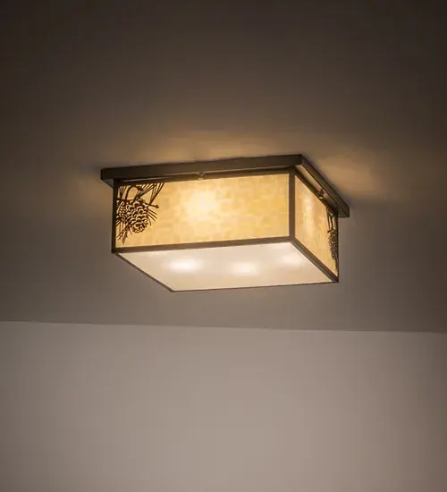 With Pinecones and Pine Needles delicately etched of Solid Brass; this compelling design represents the iconic symbol of spiritual enlightenment and eternal life. Natural charm comes alive with beautiful ambient light shining through a Beige art glass lens; enhanced with a Clear Seeded glass bottom diffuser and Craftsman Brown finished accents and hardware. The Hyde Park Winter Pine Flushmount is featured in our American-made; American-designed; handcrafted Craftsman Signature Lighting Collection. Manufactured in Yorkville; New York. UL and cUL listed for dry; damp and wet locations.