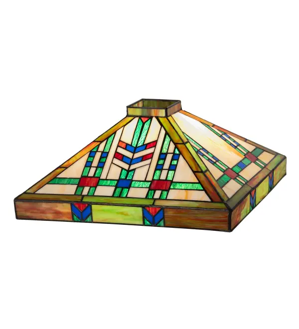 In the Prairie School architectural style; organic objects are transformed into geometric forms. This shade features colorful interlocking blocks of multi-colored glass in hues of Blue/Green; with accent blocks of Blue and Burgundy used to create stylized wheat stalks on a Beige Cream background. The stained glass shade is made using the famous Meyda Tiffany copperfoil construction process. The shade pairs well with a base to create a table or floor lamp and can be matched with hardware to build a beautiful ceiling fixture. The Prairie Wheat Shade is included in our American-designed; handmade Prairie Lighting Collection. Each shade is a unique work of art with color variations based on natural ingredients inherent in the glass.