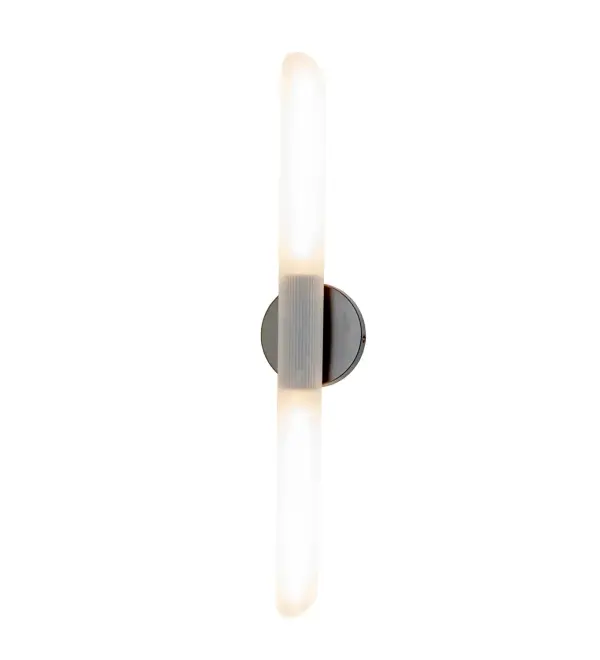 This stunning upright wall sconce features a cylindrical profile with a Fluted Frosted Crystal Idalight Cylinder lens. The wall luminaire is complemented with an Oil Rubbed Bronze backplate and hardware. The ADA-Compliant fixture is ideal for illuminating powder rooms and corridors in modern homes and restaurants from Palm Beach, Florida, to Austin, Texas, to Portland, Oregon. The Anselm Wall Sconce is featured in our American-designed, handcrafted Contemporary Lighting Collection. It is UL and cUL listed for dry and damp locations. Collection: Anselm Finish: Oil Rubbed Bronze Glass: Frosted Clear Ribbed Acrylic Width: 5.00" Height: 25.00" Length: 3.75" Weight: 2.00 lb Extension from Wall: 3.75" Number of Bulbs: 2 Maximum Wattage: 12.00 W Bulb Type: T10 Bulb Base: E26 Material: Steel Country of Origin: CHINA Safety Rating: Damp