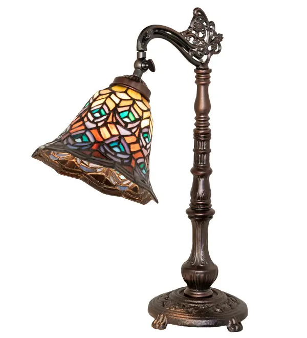Recreating one of Tiffany's most beloved designs. Mauve with Beige; Pink; Orange; and Gray art glass adorn this shade; while feathers feature Turquoise; Blue; and Purple. A scalloped crest of Purple; Blue; Orange; and Green art glass edges the shade; which is created using the Meyda Tiffany copperfoil construction and enhanced with an elegant decorative cast metal lamp base finished in a warm Mahogany Bronze. Ideal for illuminating tables and desks in homes; banks; and libraries from Exeter; New Hampshire; to Scottsdale; Arizona; to Billings; Montana.The Tiffany Peacock Feather Bridge Arm Table Lamp is featured in our American-designed; handcrafted Tiffany Reproduction Collection. UL & cUL listed for dry locations. Each shade is a unique work of art with color variations based on natural ingredients inherent in the glass.