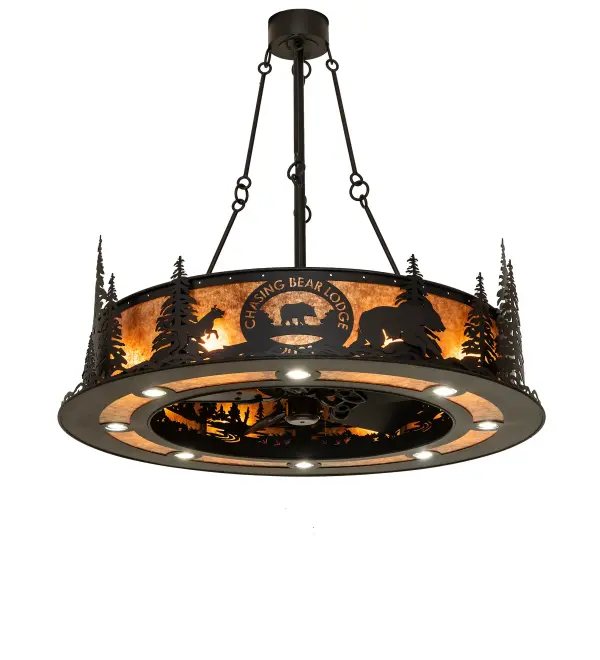 A Fan Integrated Light Fixture personalized with the name Chasing Bear Lodge. This unique custom Chandel-Air features Textured Black Tall Pine trees and wildlife surrounding the Chasing Bear Lodge name and logo on a stunning Amber Mica background. Multiple layers of light for different moods and tasks include 8 inner lights that bring out the beauty of the Mica; while 8 downlights deliver functional illumination. A windchill circulates to keep the space cool and comfortable during the summer and is reversed to pull the room air up towards the ceiling and force warm air down in winter. The Chasing Bear Lodge Chandel-Air is included in our American-made; American-designed handcrafted Chandel-Air Collection. Manufactured in Yorkville; NY. UL & cUL listed for dry and damp locations.