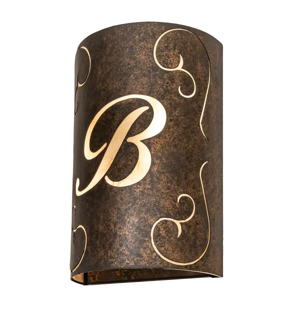 This personalized wall fixture features a Gothic Gold finished frame and a graceful scrolled design with the B Monogram that highlights with a Sahara Taupe Idalight diffuser. The Personalized B Monogram Wall Sconce is included in our Personalized Collection and is manufactured in Yorkville, New York. The fixture is UL and cUL listed for dry and damp locations. This specific wall sconce can be ordered as is or with another letter, or font of your choosing, and we will coordinate the custom logo or monogram with you to suit your project. Please call for the price and lead time. Collection: Personalized Finish: Gothic Gold Glass: Sahara Taupe Idalight Width: 10.00" Height: 15.00" Length: 5.00" Weight: 9.00 lb Extension from Wall: 5.00" Number of Bulbs: 2 Maximum Wattage: 60.00 W Bulb Type: A19 Bulb Base: E26 Material: Steel Country of Origin: USA Safety Rating: Damp