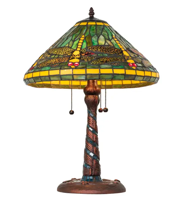 Recreating Tiffany Studio's most beloved stained glass design, this stunning lamp is modeled after the original dragonfly design. Diving dragonflies with glowing Scarlet jeweled eyes and delicate metal filigree wings circle over hand-cut and copperfoiled pieces of Amber and Green art glass. The elegant base features hand-applied Mahogany Bronze finished Dragonflies on Green art glass tiles. The lamp is ideal as an illuminating accent piece for picture windows, tables, and desks in residential and hospitality settings. The lamp design is inspired by dragonflies in marshes and ponds throughout the US, from the Florida Panhandle and Everglades, to southeast Wisconsin. The Tiffany Dragonfly Table Lamp is included in our American-designed Tiffany Reproduction Lighting Collection. UL and cUL listed for dry locations. Each shade is a unique work of art with color variations based on natural ingredients inherent in the glass. Collection: Tiffany Dragonfly Finish: Mahogany Bronze Glass: Stained Glass Blue & Aqua Mosaic Glass Width: 16.00" Height: 23.00" Length: 16.00" Weight: 9.50 lb Number of Bulbs: 3 Maximum Wattage: 60.00 W Bulb Type: A15 Bulb Base: E26 Material: Steel Country of Origin: CHINA Safety Rating: Dry