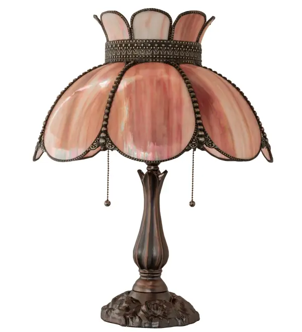Embrace the timeless look of this classic art glass lighting design. Annabelle features a Pink hand-curved art glass shade with Brass filigree finished in Craftsman Brown, highlighted to reveal an eye-catching dimensional look. The shade is accented with color-coordinated, hand-beaded glass fringe and complemented with a Mahogany Bronze finished base. Our Quality Bent Glass division is over 100 years in the making & still creating timeless masterpieces using tools & methods from the days when we supplied Tiffany Studios. The Annabelle Table Lamp is featured in our American-made, American-designed, handcrafted Quality Bent Glass Lighting Collection. Manufactured in Yorkville, NY. UL and cUL listed for dry locations. Collection: Anabelle Finish: Mahogany Bronze Craftsman Brown Highlighted Glass: Pink Iridescent Glass Width: 18.00" Height: 22.00" Length: 18.00" Weight: 11.00 lb Number of Bulbs: 2 Maximum Wattage: 60.00 W Bulb Type: A19 Bulb Base: E26 Material: Zinc Country of Origin: CHINA Safety Rating: Dry