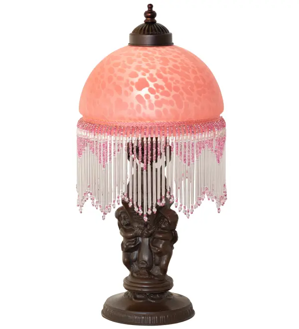 A charming nostalgic accent lamp. This Roussillon Lamp features a stunning Cranberry Mottled Glass shade color coordinated with delicate complementary glass beaded fringe. This Victorian-inspired, intricately detailed shade is combined with a beautifully detailed Twin Cherub with Lantern base in a Mahogany Bronze finish. The Roussillon Mini Lamp Lamp is included in our American-designed, handcrafted Nostalgic Collection. UL and cUL listed for dry locations. Collection: Roussillon Finish: Mahogany Bronze Glass: Cranberry Dappled Glass Width: 8.00" Height: 17.00" Length: 8.00" Weight: 4.00 lb Number of Bulbs: 1 Maximum Wattage: 60.00 W Bulb Type: A19 Bulb Base: E26 Material: Zinc Country of Origin: CHINA Safety Rating: Dry