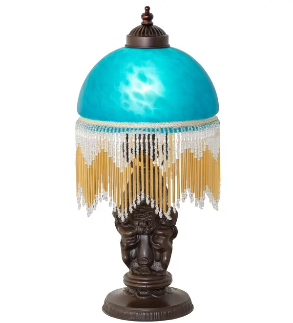 A charming nostalgic mini lamp that doubles as a decorative accent for nearly any room. This Roussillon Mini Lamp features a stunning Teal Mottled Glass shade color coordinated with delicate color-coordinated glass beaded fringe. This Victorian-inspired shade is combined with a beautifully detailed lamp base in a Mahogany Bronze finish. The Roussillon Mini Lamp is featured in our American-designed, handcrafted Victorian Lighting Collection. UL and cUL listed for dry locations. Each shade is a unique work of art with color variations based on natural ingredients inherent in the glass. Contact us if color matching is critical when ordering multiple items. Collection: Roussillon Finish: Mahogany Bronze Glass: Teal Dappled Glass Width: 8.00" Height: 17.00" Length: 8.00" Weight: 4.00 lb Number of Bulbs: 1 Maximum Wattage: 60.00 W Bulb Type: A19 Bulb Base: E26 Material: Zinc Country of Origin: CHINA Safety Rating: Dry