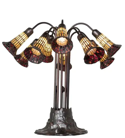 Inspired by the famous Tiffany design from the early 1900s. This table lamp features 10 stunning Honey and Red stained glass shades created using the famous Meyda Tiffany copperfoil construction technique. An elegant cast metal Lily pad base embraces the shades with fitters finished by hand in Mahogany Bronze. The Tiffany Pond Lily Light Table Lamp is included in our American-designed; handcrafted Stained Glass Lighting Collection. UL and cUL listed for dry locations. Each shade is a unique work of art with color variations based on natural ingredients inherent in the glass. Please contact us if color matching is critical when ordering multiple items. - alternate view