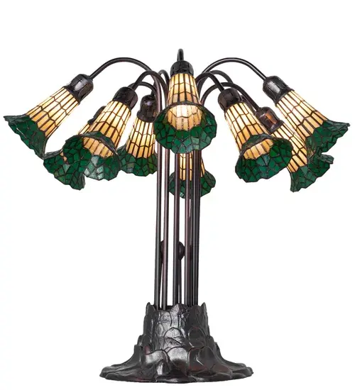 Inspired by the famous Tiffany design from the early 1900s. This table lamp features 10 stunning Honey and Red stained glass shades created using the famous Meyda Tiffany copperfoil construction technique. An elegant cast metal Lily pad base embraces the shades with fitters finished by hand in Mahogany Bronze. The Tiffany Pond Lily 10 Light Table Lamp is included in our American-designed, handcrafted Stained Glass Lighting Collection. UL and cUL listed for dry locations. Each shade is a unique work of art with color variations based on natural ingredients inherent in the glass. Please contact us if color matching is critical when ordering multiple items. Collection: Stained Glass Pond Lily Finish: Mahogany Bronze Glass: Honey Wispy/Kelly Green Width: 25.00" Height: 24.00" Length: 25.00" Weight: 19.00 lb Number of Bulbs: 10 Maximum Wattage: 25.00 W Bulb Type: B10 Bulb Base: E12 Material: Zinc Country of Origin: CHINA Safety Rating: Dry - alternate view