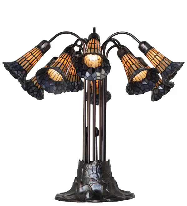 Inspired by the famous Tiffany design from the early 1900s. This table lamp features 10 stunning shades created of Honey and Purple art glass using the famous Meyda Tiffany copperfoil construction technique. An elegant cast metal Lily pad base embraces the shades with fitters finished by hand in Mahogany Bronze. The Tiffany Pond Lily Light Table Lamp is included in our American-designed, handcrafted Stained Glass Lighting Collection. UL and cUL listed for dry locations. Each shade is a unique work of art with color variations based on natural ingredients inherent in the glass. Please contact us if color matching is critical when ordering multiple items. Collection: Stained Glass Pond Lily Finish: Mahogany Bronze Glass: Honey Wispy & Purple Width: 25.00" Height: 24.00" Length: 25.00" Weight: 17.00 lb Number of Bulbs: 10 Maximum Wattage: 25.00 W Bulb Type: B10 Bulb Base: E12 Material: Zinc Country of Origin: CHINA Safety Rating: Dry