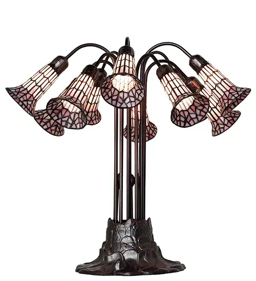 Inspired by the famous Tiffany design from the early 1900s. This table lamp features 10 stunning Pink stained glass shades created using the famous Meyda Tiffany copperfoil construction technique. An elegant cast metal Lily pad base embraces the shades with fitters finished by hand in Mahogany Bronze. The Tiffany Pond Lily Light Table Lamp is included in our American-designed, handcrafted Stained Glass Lighting Collection. UL and cUL listed for dry locations. Each shade is a unique work of art with color variations based on natural ingredients inherent in the glass. Please contact us if color matching is critical when ordering multiple items. Collection: Stained Glass Pond Lily Finish: Mahogany Bronze Glass: Pink Width: 25.00" Height: 24.00" Length: 25.00" Weight: 17.00 lb Number of Bulbs: 10 Maximum Wattage: 25.00 W Bulb Type: B10 Bulb Base: E12 Material: Zinc Country of Origin: CHINA Safety Rating: Dry - alternate view