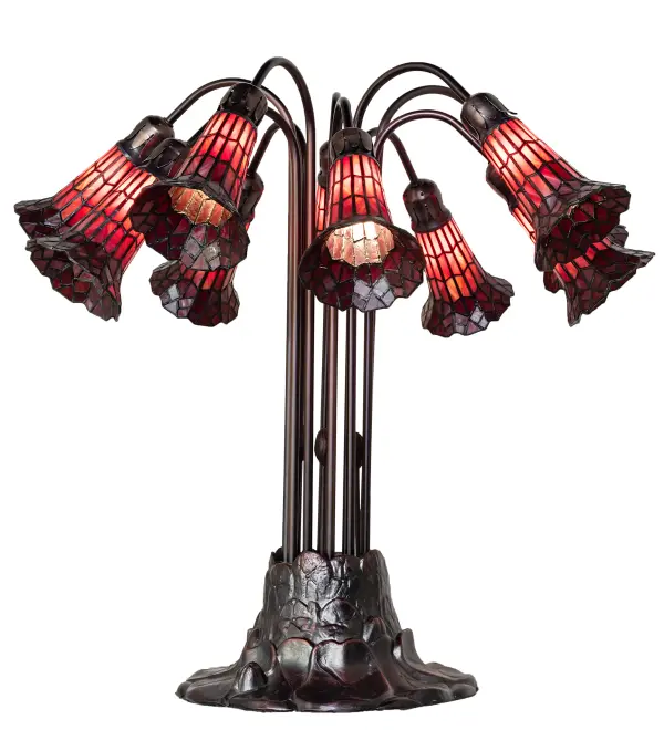 Inspired by the famous Tiffany design from the early 1900s. This table lamp features 10 stunning Red stained glass shades created using the famous Meyda Tiffany copperfoil construction technique. An elegant cast metal Lily pad base embraces the shades with fitters finished by hand in Mahogany Bronze. The Tiffany Pond Lily Light Table Lamp is included in our American-designed, handcrafted Stained Glass Lighting Collection. UL and cUL listed for dry locations. Each shade is a unique work of art with color variations based on natural ingredients inherent in the glass. Please contact us if color matching is critical when ordering multiple items. Collection: Stained Glass Pond Lily Finish: Mahogany Bronze Glass: Red Width: 25.00" Height: 24.00" Length: 25.00" Weight: 17.00 lb Number of Bulbs: 10 Maximum Wattage: 25.00 W Bulb Type: B10 Bulb Base: E12 Material: Zinc Country of Origin: CHINA Safety Rating: Dry