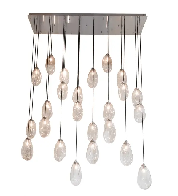 Inspired by nebulous clusters of bubbles blown on a newly married couple sashaying down the steps after walking down the aisle of a joyous wedding ceremony. Innovation and imagination are integrated for a stunning decorative lighting look. A captivating; illuminating design; this cascading pendant displays 24 Clear Blown Glass teardrop elements; each reveals Edison-styled LED lamps. The lovely shade configuration is enhanced with hardware finished in Extreme Chrome. The pendant is perfect for foyers; lobbies; and other spaces with tall ceilings in large residences; hotels; and restaurants; or above kitchen islands; counters; bars; and tables from Boston; Massachusetts and New York; New York; to Washington; DC and Philadelphia; Pennsylvania; to Miami; Florida and San Francisco; California. The Celine 24 Light Oblong Cascading Pendant is featured in our American-made; American-designed; handmade Modern Lighting Collection and manufactured in Yorkville; NY. UL & cUL listed for dry and damp locations.