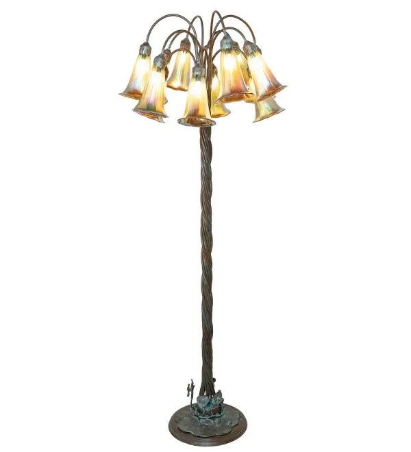Recreating the famous Tiffany design from the early 1900s. This elegant floor lamp features 12 Amber Favrile Style shades mouth blown of fine art glass. The Pond Lily shades are made in the USA by an artist who specializes in the real Tiffany style of glass making, and are suspended from metal stems delicately winding above a Lily pad floor base made by hand in Cast Bronze. Our Tiffany Pond Lily 12 Light Floor Lamp is included in the American-designed, handcrafted Favrile Glass Lighting Collection. UL and cUL listed for dry locations. Each shade is a unique work of art with color variations based on natural ingredients inherent in the glass. Please contact us if color matching is critical when ordering multiple items. Collection: Amber Finish: Bronze Glass: Amber Iridescent Blown Glass Width: 26.00" Height: 61.00" Length: 26.00" Weight: 19.00 lb Number of Bulbs: 12 Maximum Wattage: 25.00 W Bulb Type: BA9 Bulb Base: E12 Material: Bronze Country of Origin: CHINA Safety Rating: Dry