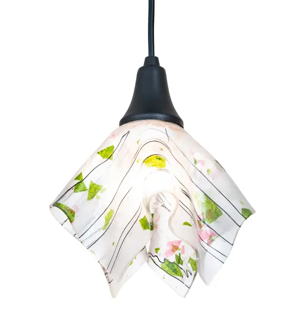 Contemporary; fun; transitional; elegant; and creative. Nothing compares to this stunning art piece; which features high-fired fused glass in Leaf and Avocado Green and Cerulean and Red accents on a Clear background transformed into an abstract handkerchief shape. This Brass fixture is enhanced with a Textured Black finish. The overall height ranges from 13 to 60 inches; as the cord length can be easily adjusted in the field to accommodate your specific lighting application needs. Suspend the mini pendants in groups to create a dramatic design statement over bars; counters; kitchen islands; and tables. Perfect for placement in homes; restaurants; and boutiques from Greenwich Village; New York City; and Chicago; Illinois; to Dallas; Texas. The Tossalad Handkerchief Mini Pendant is included in our American-made; American-designed; handcrafted Abstract Lighting Collection and manufactured in Yorkville; New York. UL and cUL listed for dry and damp locations.