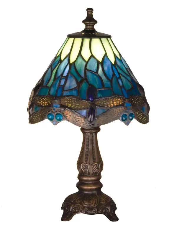 This version of Tiffany Studio's most beloved stained glass dragonfly design is modeled after the original hanging head dragonfly. Diving dragonflies with glowing Blue jeweled eyes and delicate metal filigree wings circle over hand cut and copper foiled pieces of Lakeside Blue and Pond Green glass that represent rippling water. The base is finished in a warm hand applied Mahogany Bronze. Collection: Tiffany Hanginghead Dragonfly Finish: Mahogany Bronze Glass: Blue/Green Water/Green Opal Width: 7.00" Height: 11.50" Length: 7.00" Weight: 1.00 lb Number of Bulbs: 1 Maximum Wattage: 60.00 W Bulb Type: B10 Bulb Base: E12 Material: Zinc Country of Origin: CHINA Safety Listing: Dry Safety Rating: Dry