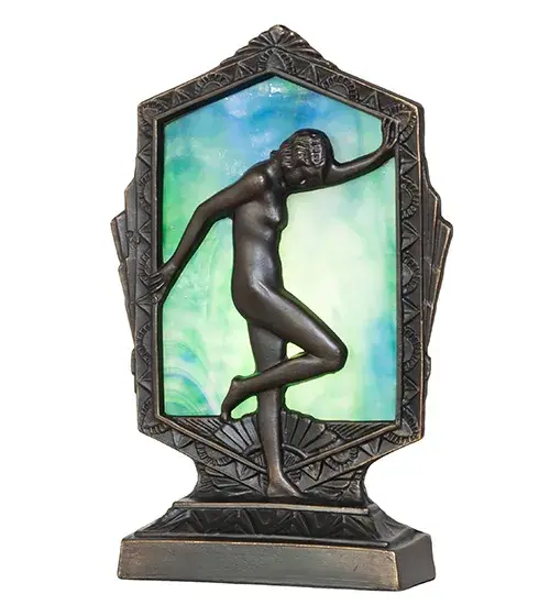A graceful posing lady is highlighted on this Deco-styled accent lamp. The elegant metal statuette finished in Antique Brass is complemented with a stunning Blue/Green Ripple Glass lens that illuminates from the back. The accent lamp is perfect for lighting desktops; tabletops; and other spaces in various residential and hospitality settings; from Newport; Rhode Island; to Raleigh; North Carolina; to Fort Worth; Texas. The Posing Deco Lady Accent Lamp is included in our American-designed; handcrafted Art Deco Collection. UL and cUL listed for dry locations. - alternate view