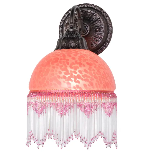 A charming nostalgic wall sconce that is perfect for nearly any room. This Roussillon features a stunning Cranberry Dappled Glass shade color coordinated with delicate Cranberry and Clear glass beaded fringe. Elegant cast metal hardware in a Mahogany Bronze finish embraces this Victorian-inspired shade. This wall sconce is perfect for placing along walls in hallways and living spaces in fine Victorian homes from Pawtucket, Rhode Island, to Pittsburgh, Pennsylvania, to Albuquerque, New Mexico. The Roussillon Wall Sconce is featured in our American-designed, handcrafted Boudoir Lighting Collection. UL and cUL listed for dry and damp locations. Each shade is a unique work of art with color variations based on natural ingredients inherent in the glass. Collection: Roussillon Finish: Mahogany Bronze Glass: Cranberry Dappled Glass Width: 8.00" Height: 14.00" Length: 9.50" Weight: 3.50 lb Extension from Wall: 9.50" Number of Bulbs: 1 Maximum Wattage: 60.00 W Bulb Type: A19 Bulb Base: E26 Material: Steel Country of Origin: CHINA Safety Rating: Damp