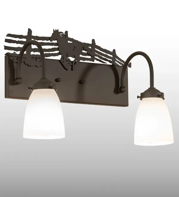 Running wild in a western-style corral; this Running Horse is adorned with a windswept mane and flowing tail on this stunning vanity light fixture. The metal horse silhouette is graced with muscle that is so powerful yet so gentle. This exquisite wall sconce features a matching frame and hardware in an Oil Rubbed Bronze finish and is complemented with two White Opal Glass shades. This vanity light is ideal for illuminating fine baths; hallways; and other residential; hospitality; and commercial spaces. The Running Horse 2 Light Vanity Light is included in our American-made; American-designed; handcrafted Western Lighting Collection. This fixture is manufactured in Yorkville; New York. UL and cUL listed for dry and damp locations.