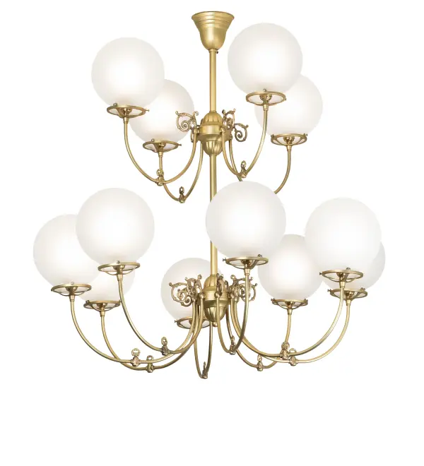 Combining the revival look of gas and electric reproductions; this magnificent chandelier offers an eye-catching look with 12 stunning Globe-styled elements offered in Clear Frosted Glass. An elegant frame; hardware; and scrollwork are featured in a luxurious Polished Brass. The decorative accents resemble authentic paddle switches used in antique lighting. The shades are embraced by Mahogany Bronze finished hardware designed and crafted with the exact details of old-world artisanship. The chandelier is ideal for illuminating lobbies and patron service areas in restaurants and retailers. The Revival Gas & Electric 12 Light Chandelier is included in our American-designed handcrafted Revival Collection. UL and cUL listed for dry and damp locations. The fixture is featured in Jenkinson's Sweet Shop in Point Pleasant Beach; New Jersey.